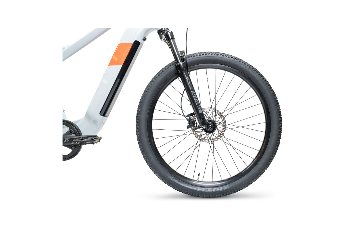 Close up of the wheel and 100mm travel front suspension on the Priority E-Sauce.