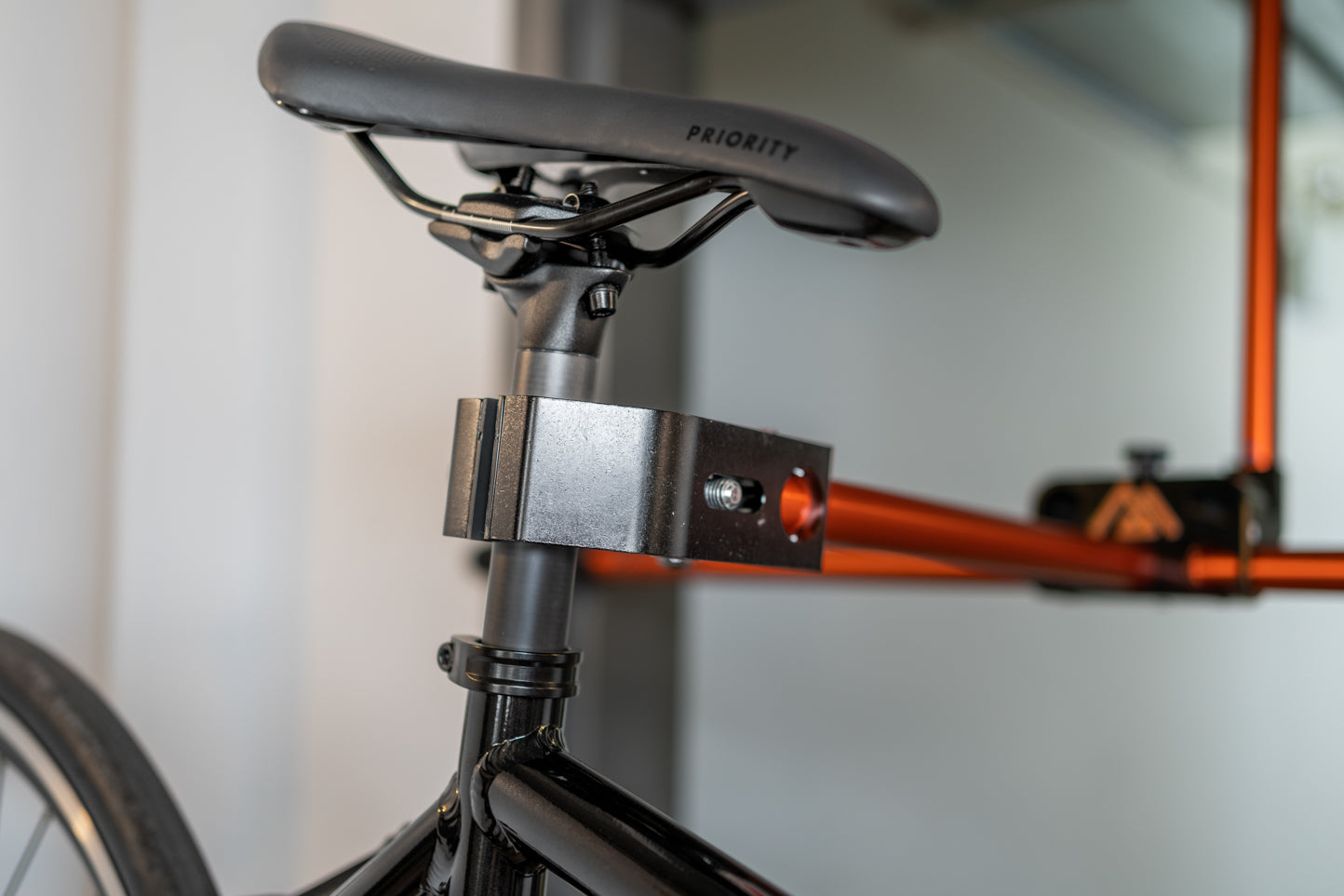 Orange and black bike rack for repairs and maintenance